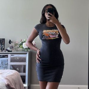 Dark grey bodycon dress with sleeves and race print on front.